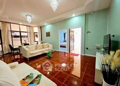 Spacious living room with elegant decor and modern lighting