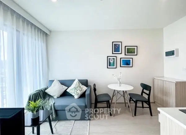Modern living room with cozy sofa, stylish decor, and natural light