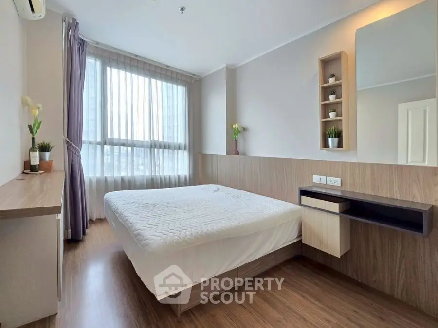 Modern bedroom with large window and stylish wooden accents