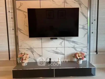 Modern living room with marble TV wall and elegant decor