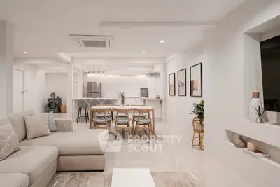 Spacious open-plan living room with modern kitchen and elegant decor