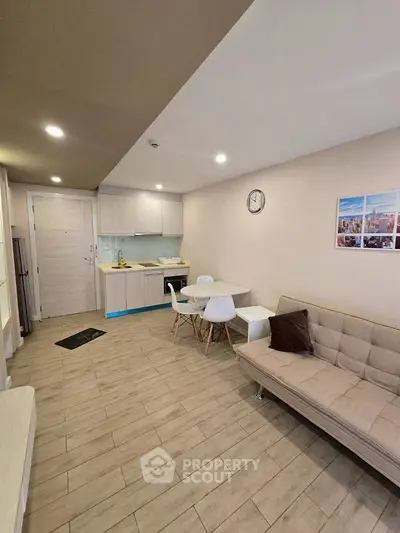 Modern living room with open kitchen and stylish furniture