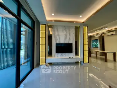 Luxurious modern living room with marble accent wall and sleek lighting