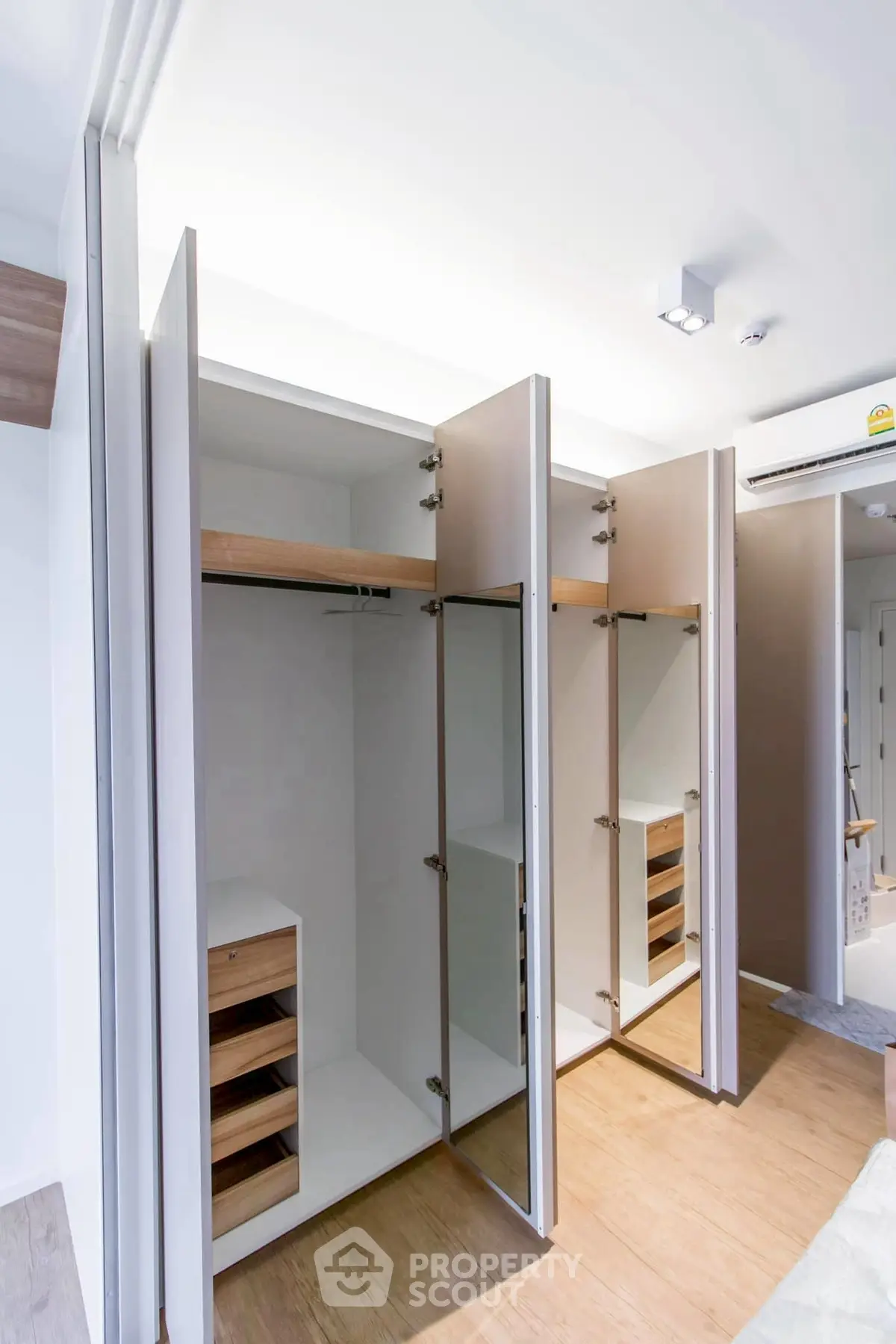 Spacious modern walk-in closet with ample storage and sleek design