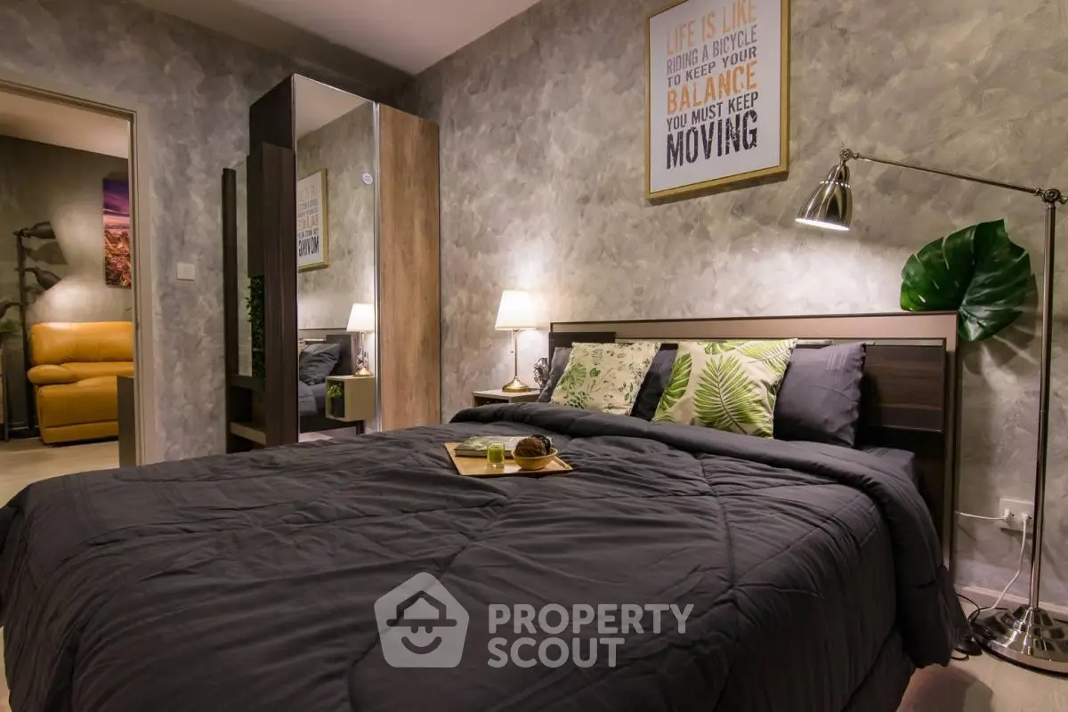 Cozy bedroom with modern decor and stylish lighting, perfect for relaxation.