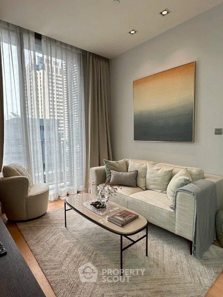 Elegant living room with modern decor and large window offering city views.