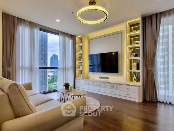 Luxurious living room with modern decor and city view, featuring elegant lighting and cozy seating.