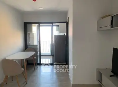 Modern apartment with open layout, dining area, and balcony access for urban living.