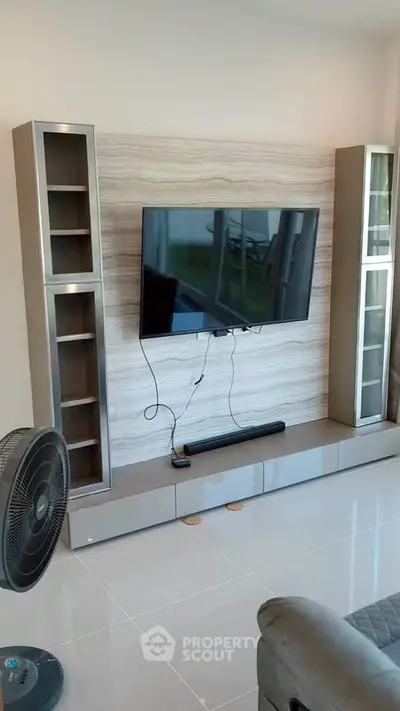 Modern living room with sleek TV unit and stylish decor