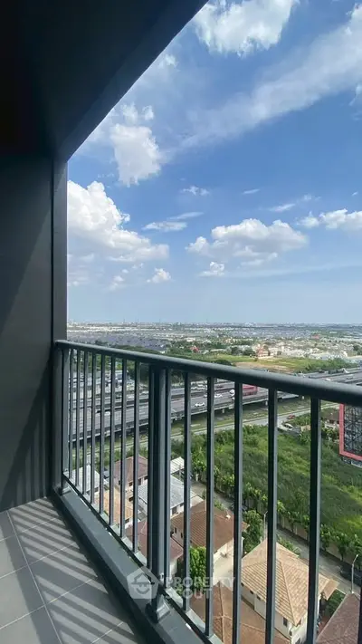 Stunning balcony view with expansive cityscape and blue sky