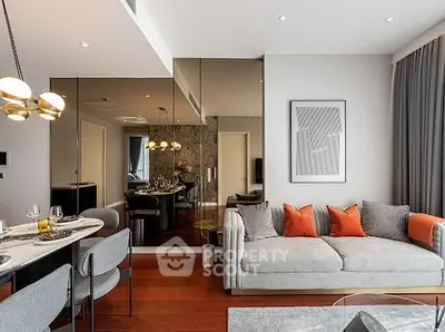Modern living room with elegant decor and dining area, featuring stylish furniture and warm lighting.