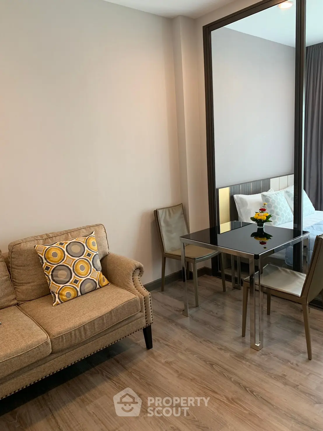 Modern living room with stylish decor and cozy seating in a contemporary apartment.