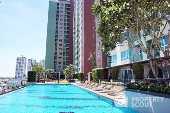 Luxurious high-rise apartment with stunning pool and city view, perfect for modern urban living.