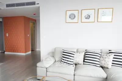 Modern living room with stylish sofa and wall art in a contemporary apartment