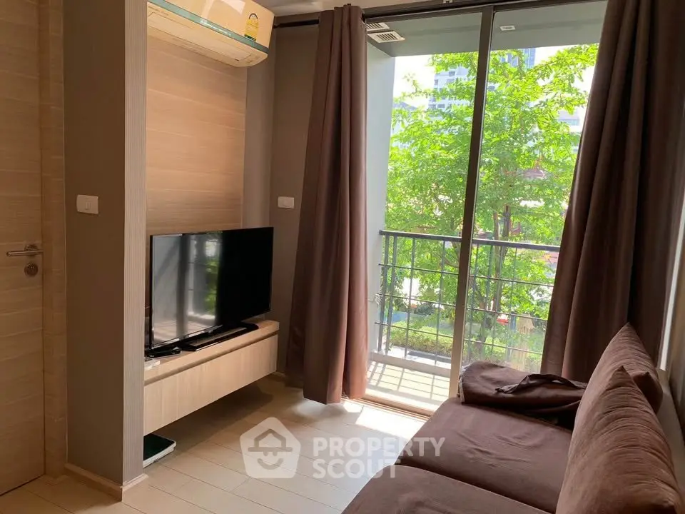 Cozy living room with modern decor and balcony view