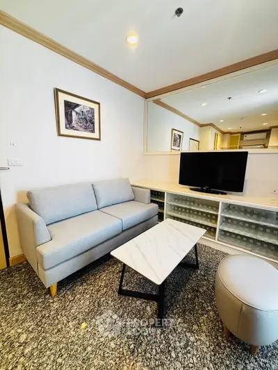 Cozy living room with modern sofa and marble coffee table, perfect for relaxation.