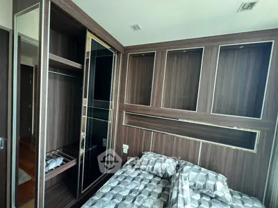 Modern bedroom with stylish wood paneling and built-in storage solutions
