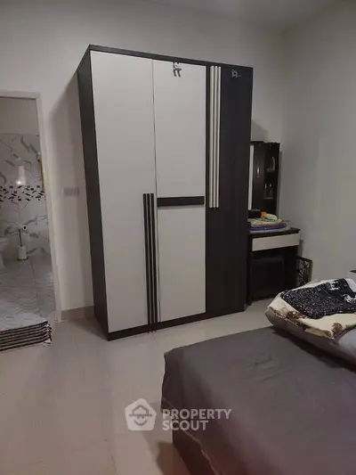 Cozy bedroom with modern wardrobe and stylish decor