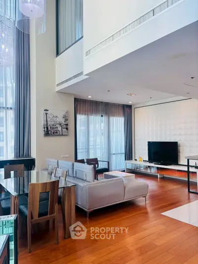 Luxurious modern living room with high ceilings and elegant decor