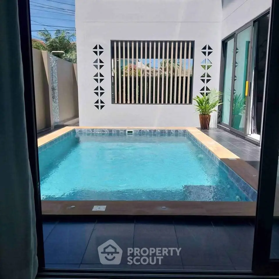 Modern home with private pool and stylish patio area, perfect for relaxation and entertainment.