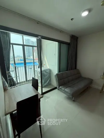 Modern living room with balcony view in urban apartment