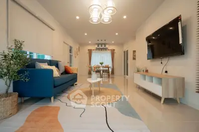 Modern living room with stylish decor and wall-mounted TV