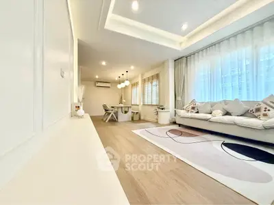 Spacious modern living room with elegant decor and ample natural light