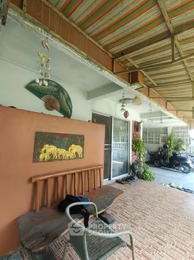 Charming outdoor patio with rustic decor and seating area