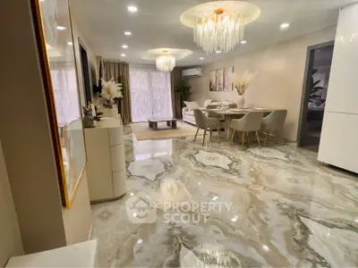 Luxurious living room with elegant chandelier and marble flooring in modern apartment