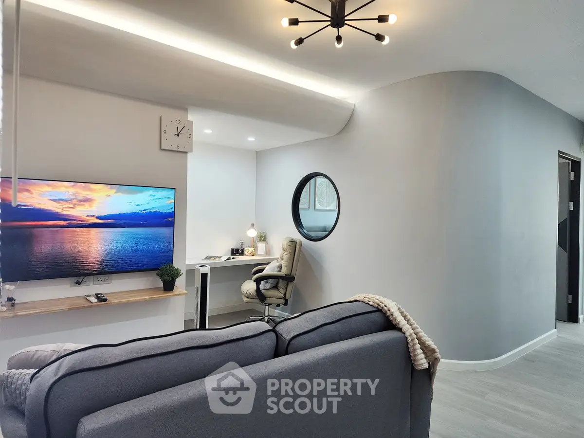 Modern living room with stylish decor and cozy workspace