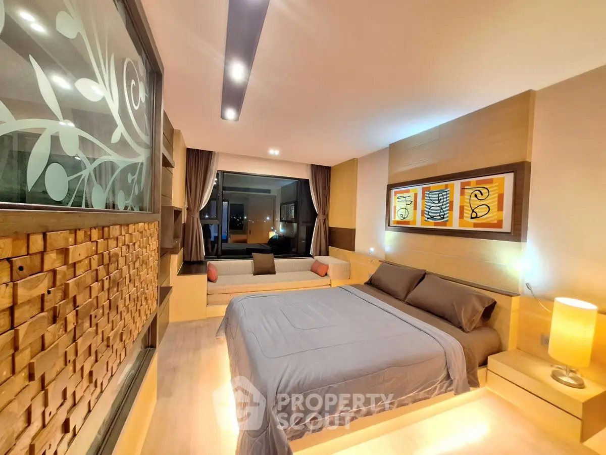 Luxurious modern bedroom with stylish decor and ambient lighting