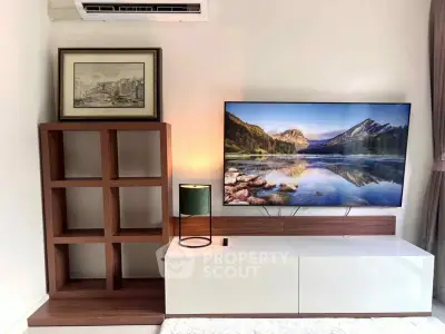 Modern living room with stylish TV setup and elegant shelving unit