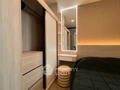 Modern bedroom with built-in wardrobe and stylish lighting