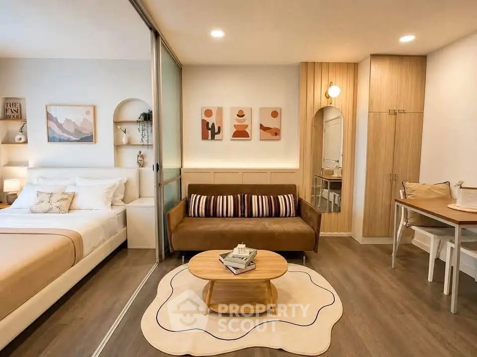 Modern studio apartment with cozy living area and stylish decor