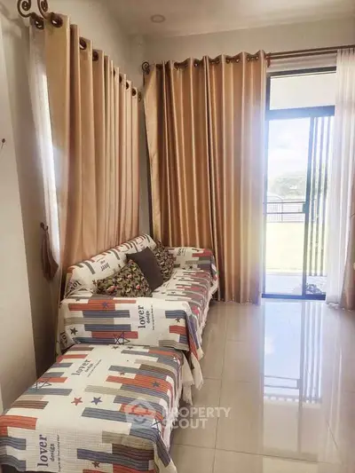 Bright living room with stylish curtains and cozy seating area.