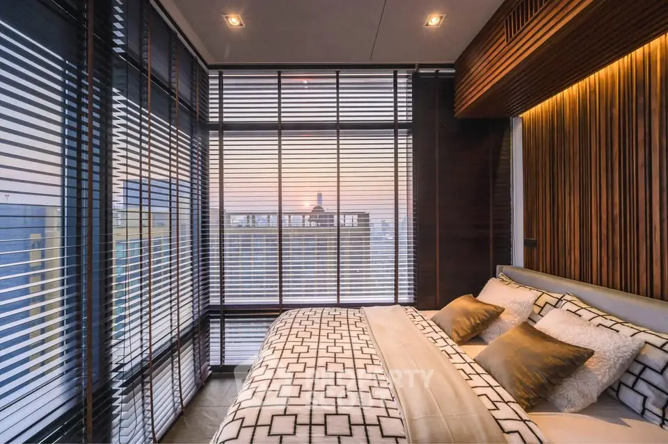 Luxurious bedroom with panoramic city view and elegant decor