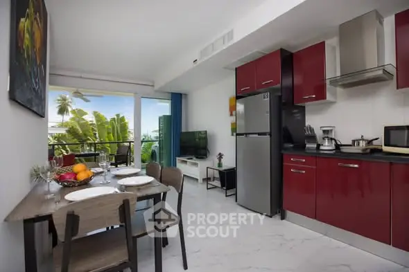 Modern kitchen and dining area with red cabinets and balcony view