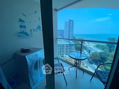Stunning balcony with ocean view in high-rise apartment, perfect for relaxation and enjoying the sea breeze.