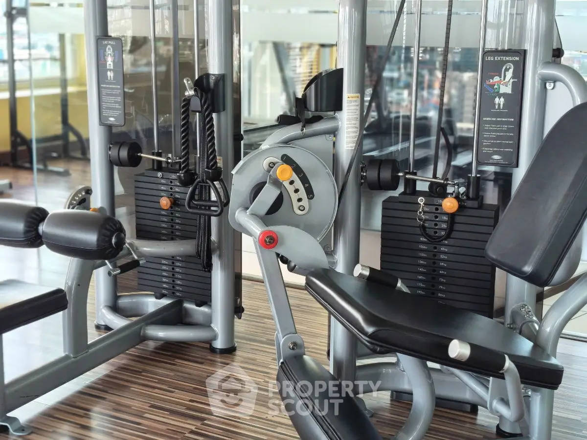 Modern gym equipment in a well-lit fitness center with sleek design.