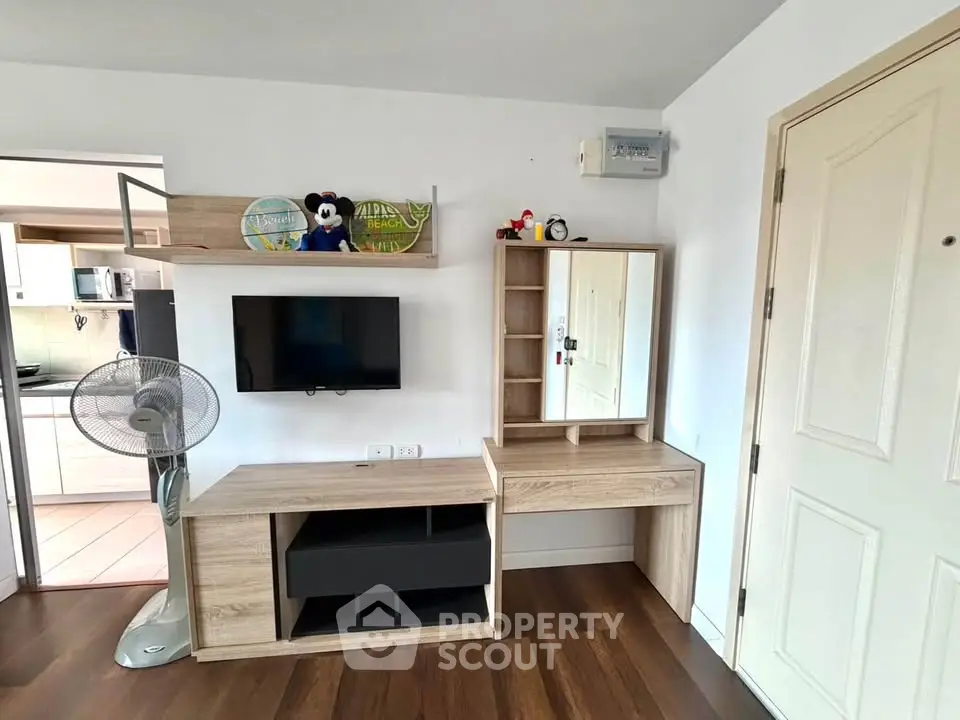 Modern living room with stylish wooden furniture and wall-mounted TV