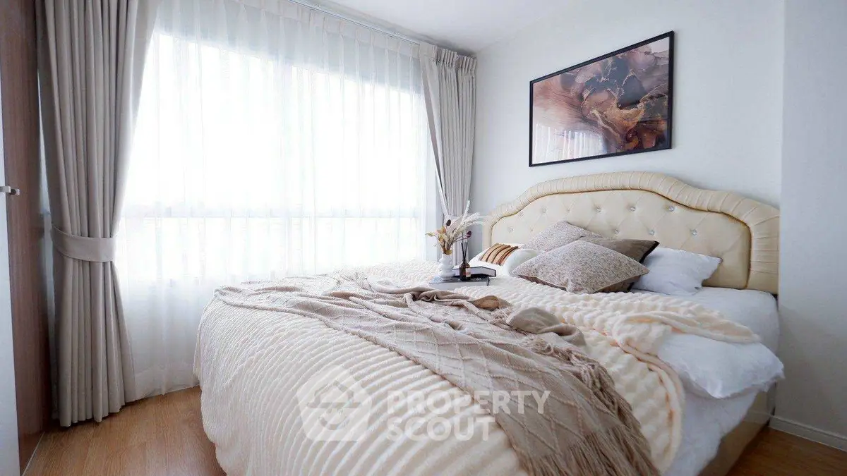 Cozy and elegant bedroom with plush bedding and natural light