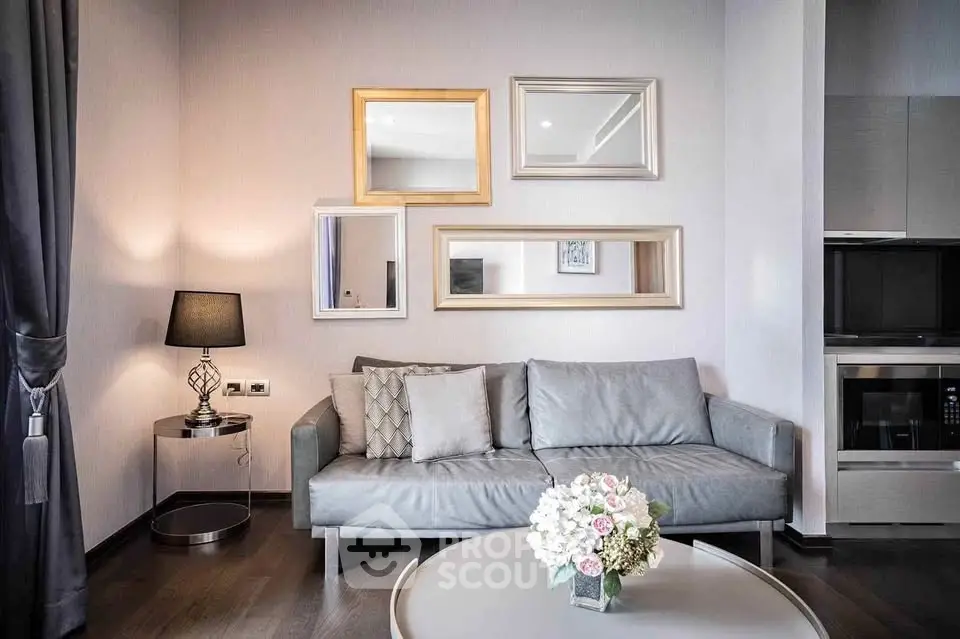 Elegant living room with modern decor and stylish furniture, featuring a cozy sofa and chic wall art.