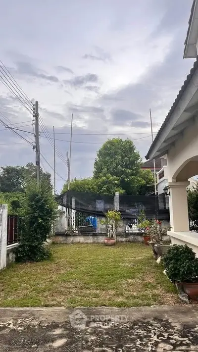Charming suburban home with lush garden and spacious yard, perfect for family living.