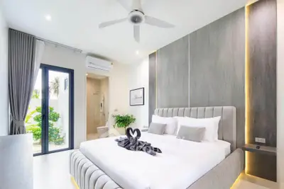 Luxurious modern bedroom with ensuite bathroom and elegant decor