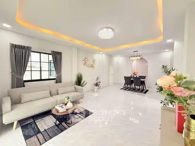 Spacious modern living room with elegant dining area and stylish lighting