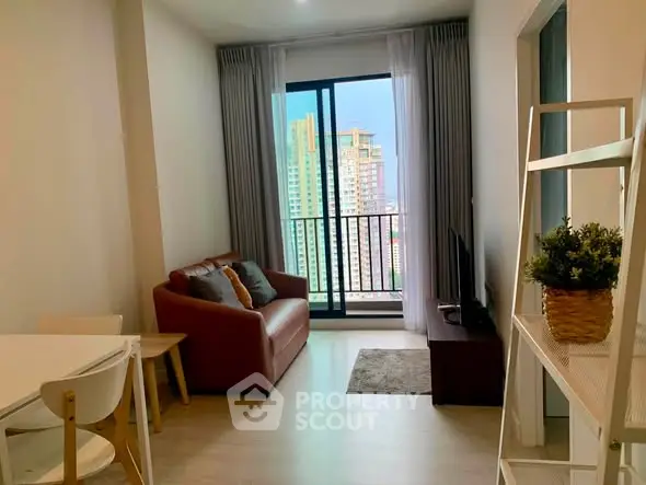 Modern living room with city view, cozy seating, and stylish decor in a high-rise apartment.