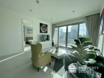 Modern living room with city view, stylish furniture, and large windows for natural light.