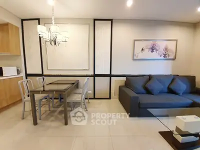 Modern living room with elegant dining area and stylish decor