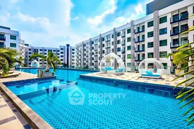 Luxurious apartment complex with stunning pool and modern architecture.