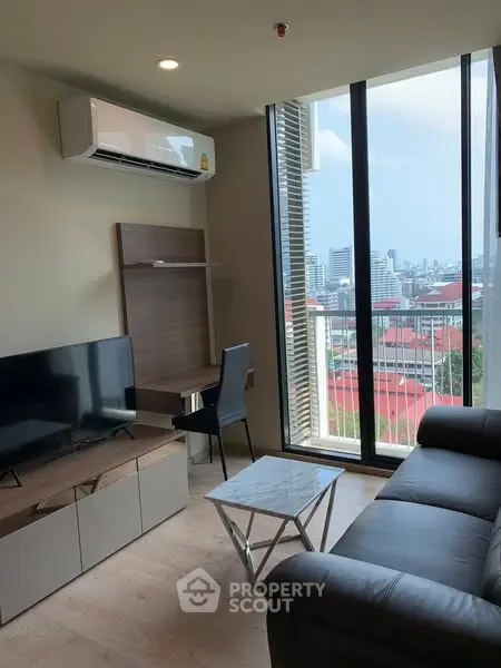 Modern living room with city view, sleek furniture, and large windows.
